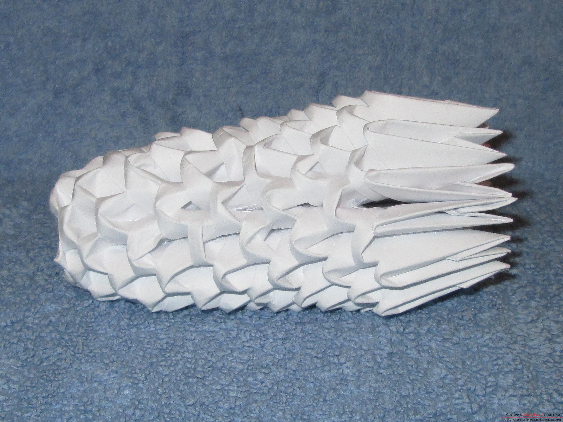 Если вы любите собирать модульное оригами, этот мастер-класс по созданию дельфина из бумаги для вас.. Фото №9